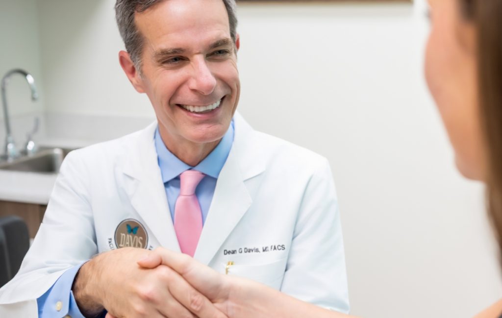 Dr. Davis shaking hands with a patient