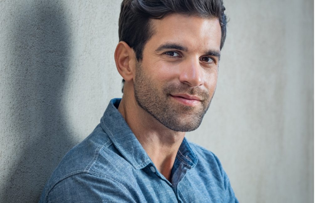 Man leaning on a wall