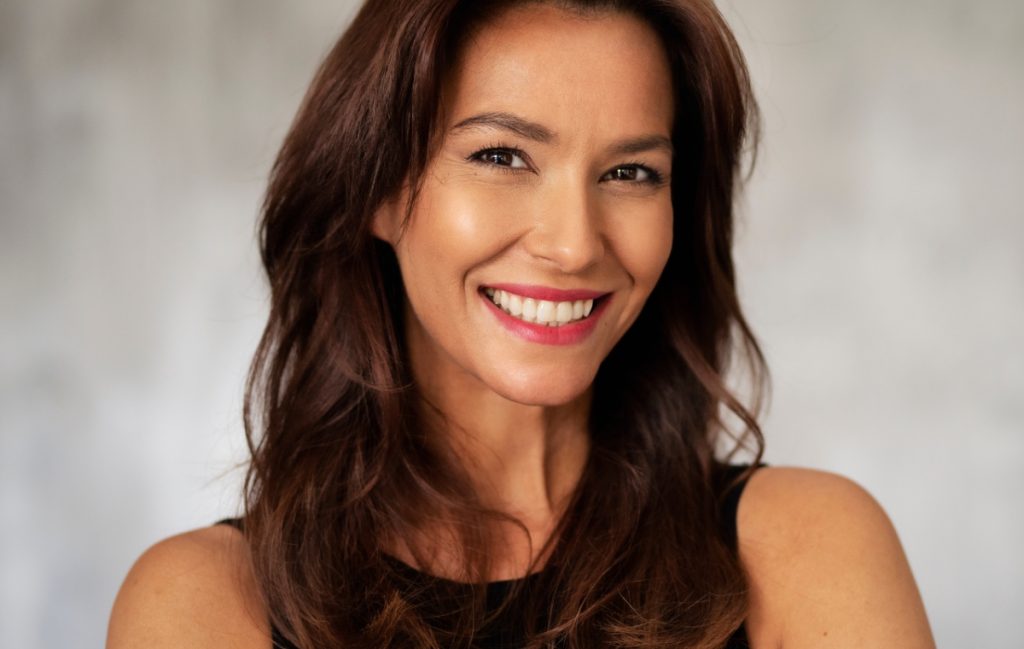 Woman wearing black shirt smiling
