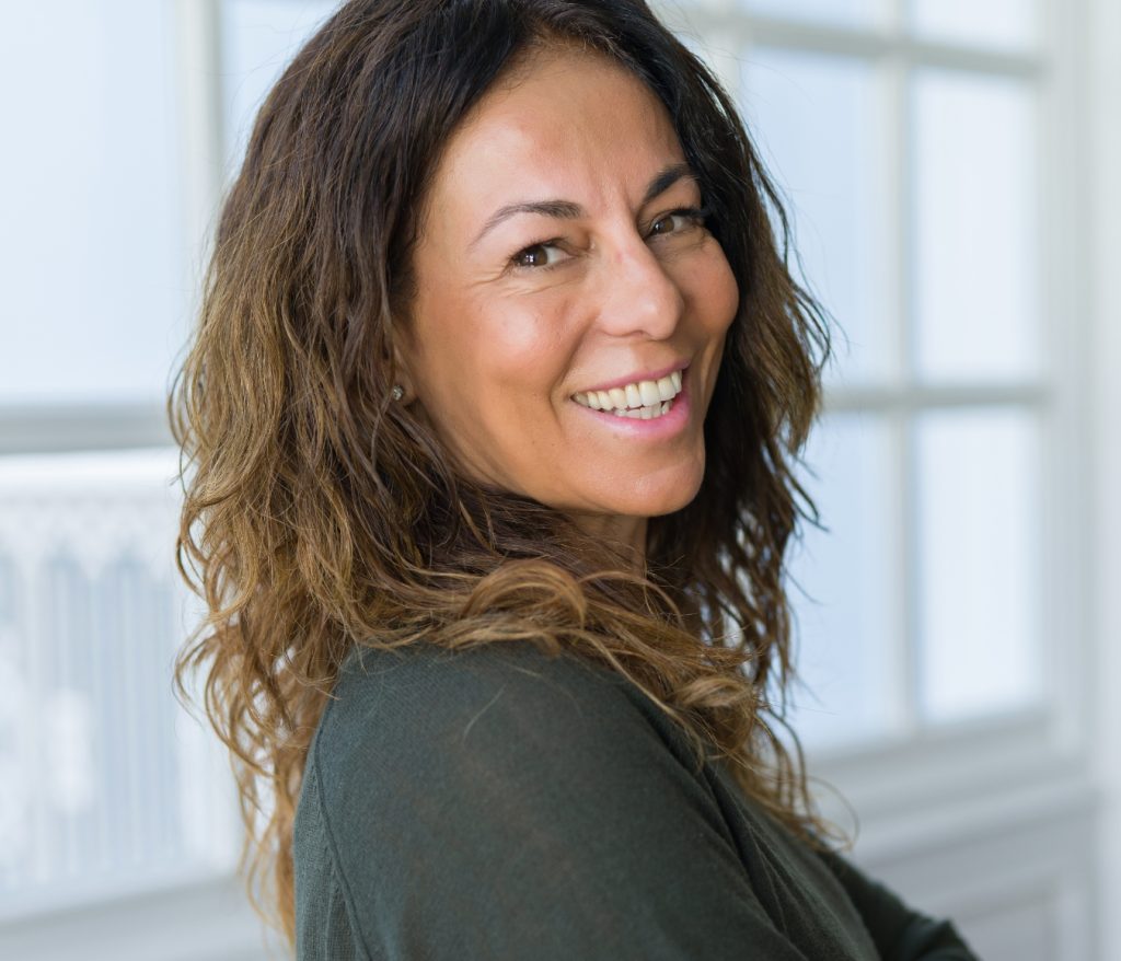 woman smiling conspiratorially